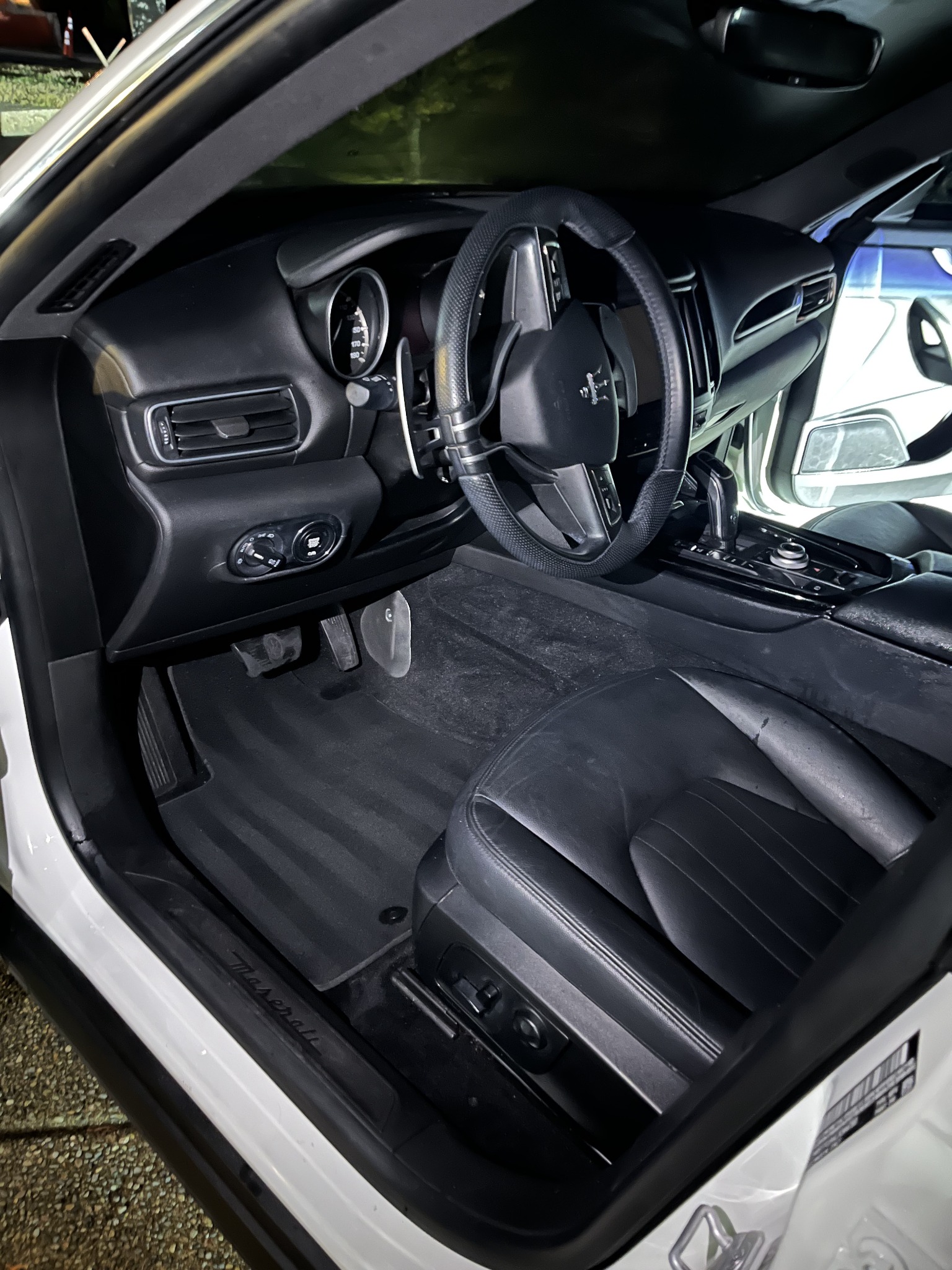 Detailed Maserati front cabin with clean seats and carpet